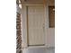 Close-up of a front door with stone trim and neutral paint at 17810 W Marshall Ln, Surprise, AZ 85388