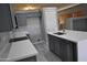 Modern kitchen featuring gray cabinets, white countertops, stainless steel appliances, and a large island at 17810 W Marshall Ln, Surprise, AZ 85388