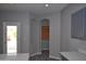 Bright kitchen showcasing a doorway, recessed lighting, and modern gray cabinetry with white countertop at 17810 W Marshall Ln, Surprise, AZ 85388