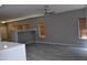 Bright living room with wood-look floors, gray walls, and plenty of natural light at 17810 W Marshall Ln, Surprise, AZ 85388