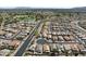 Aerial view of residential neighborhood featuring golf course and walking trails at 18058 W Weatherby Dr, Surprise, AZ 85374