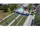 Aerial view of the community bocce ball courts, covered seating area, and a glimpse of the pool at 18058 W Weatherby Dr, Surprise, AZ 85374