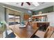 Open kitchen featuring stainless steel appliances, a center island with bar seating, and sliding door access to the patio at 18058 W Weatherby Dr, Surprise, AZ 85374