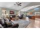 Bright and airy living room with tile floors, an open layout, and a comfortable seating arrangement at 18058 W Weatherby Dr, Surprise, AZ 85374