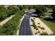 View of a tree lined street leading to neighborhood at 18058 W Weatherby Dr, Surprise, AZ 85374