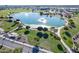 Aerial view of the community lake featuring walking trails and scenic green spaces for outdoor enjoyment and recreation at 18525 N Larkspur Dr, Maricopa, AZ 85138