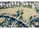 Aerial view of neighborhood park and green space with walking path and playground at 18525 N Larkspur Dr, Maricopa, AZ 85138