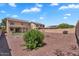 Wide angle view of the backyard with low maintenance gravel and small patch of artificial turf at 18525 N Larkspur Dr, Maricopa, AZ 85138