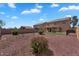 Spacious backyard featuring low-maintenance landscaping and ample space for outdoor activities at 18525 N Larkspur Dr, Maricopa, AZ 85138