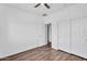 Bedroom showcases laminate floors, ceiling fan and a closet for ample storage at 18525 N Larkspur Dr, Maricopa, AZ 85138