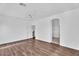 Large bedroom boasts hardwood floors, natural light, and a ceiling fan at 18525 N Larkspur Dr, Maricopa, AZ 85138