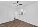 The Primary bedroom is bright and airy, featuring hardwood floors and a ceiling fan at 18525 N Larkspur Dr, Maricopa, AZ 85138