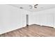Bright bedroom features hard surface floors, ceiling fan and a double door closet at 18525 N Larkspur Dr, Maricopa, AZ 85138