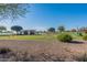 Community park includes picnic areas, walking trails, play structures, and a scenic lake for recreational activities at 18525 N Larkspur Dr, Maricopa, AZ 85138