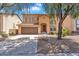 Charming two-story home with desert landscaping, a two-car garage, and inviting curb appeal at 18525 N Larkspur Dr, Maricopa, AZ 85138