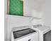 Well organized laundry room with washer and dryer at 18525 N Larkspur Dr, Maricopa, AZ 85138