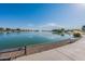 Tranquil lakeside park offering scenic views, seating, and walking paths for residents to enjoy a peaceful retreat and outdoor activities at 18525 N Larkspur Dr, Maricopa, AZ 85138