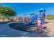 Colorful community playground with slides and climbing structures for outdoor activities in a Gathering-friendly neighborhood at 18525 N Larkspur Dr, Maricopa, AZ 85138