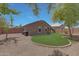 Spacious backyard featuring a well-maintained lawn and brick perimeter wall at 18590 W Vogel Ave, Goodyear, AZ 85338