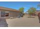 Large backyard with gravel, a block wall and a covered grill at 18590 W Vogel Ave, Goodyear, AZ 85338
