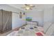 This bedroom features a light ceiling fan and dresser for storage at 18590 W Vogel Ave, Goodyear, AZ 85338