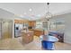 Bright eat-in kitchen features a spacious island, stainless steel appliances, and recessed lighting at 18590 W Vogel Ave, Goodyear, AZ 85338
