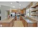 Well-lit kitchen with stainless steel appliances and a functional island for meal preparation at 18590 W Vogel Ave, Goodyear, AZ 85338