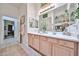 Bright bathroom with double sinks, stylish decor, and a large mirror, creating a serene and inviting space at 18650 N 91St Ave # 3701, Peoria, AZ 85382