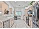 Bright kitchen with stainless steel appliances, light cabinets, and decorative touches, perfect for gathering and entertaining at 18650 N 91St Ave # 3701, Peoria, AZ 85382