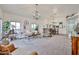 Spacious living room with stylish decor, comfortable seating, a dining area, and an open layout at 18650 N 91St Ave # 3701, Peoria, AZ 85382