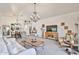 Open-concept living area showcasing chandelier lighting, decorative accents, and comfortable seating arrangements at 18650 N 91St Ave # 3701, Peoria, AZ 85382