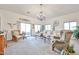 Bright living room with comfortable seating, decorative elements, and plenty of natural light from the windows at 18650 N 91St Ave # 3701, Peoria, AZ 85382