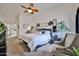Serene main bedroom with vaulted ceiling, accent plants, sitting area, and modern decor at 18650 N 91St Ave # 3701, Peoria, AZ 85382