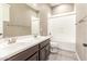 Bathroom with double vanity, toilet, and combination shower and tub at 20592 E Reins Rd, Queen Creek, AZ 85142
