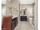 Bright bathroom featuring double mirrors, walk-in shower and tub, and tile floors at 20592 E Reins Rd, Queen Creek, AZ 85142