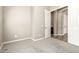 Bedroom with gray carpet and door leading to other rooms at 20592 E Reins Rd, Queen Creek, AZ 85142