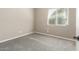 Bedroom featuring gray carpet, natural lighting, and neutral paint at 20592 E Reins Rd, Queen Creek, AZ 85142