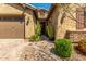 Welcoming exterior with a desert landscaped yard and covered entryway at 20592 E Reins Rd, Queen Creek, AZ 85142