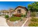 Charming single-Gathering home showcasing desert landscaping and a two-car garage at 20592 E Reins Rd, Queen Creek, AZ 85142