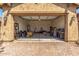 Spacious two-car garage featuring ample storage and an organized layout for vehicles and equipment at 20592 E Reins Rd, Queen Creek, AZ 85142