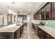 Kitchen with dark cabinetry, granite counters and backsplash, and stainless steel appliances at 20592 E Reins Rd, Queen Creek, AZ 85142