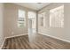 Open living area with vinyl floors and decorative wall cutouts at 20592 E Reins Rd, Queen Creek, AZ 85142