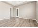 Bright living room featuring beautiful hardwood floors, neutral color palette, and natural lighting at 20592 E Reins Rd, Queen Creek, AZ 85142