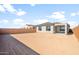 Expansive backyard with block wall and covered patio, perfect for outdoor living at 21352 N 271St Dr, Buckeye, AZ 85396