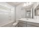 Clean, bright bathroom features a shower and tub combo, a spacious vanity with drawers at 21352 N 271St Dr, Buckeye, AZ 85396