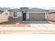 Charming single-story home with neutral tones, a two-car garage, and a tile roof at 21352 N 271St Dr, Buckeye, AZ 85396