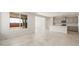 Open living space showcasing tile floors, with kitchen and living room access at 21352 N 271St Dr, Buckeye, AZ 85396