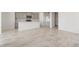 Bright open-concept living space featuring tile floors with kitchen area at 21352 N 271St Dr, Buckeye, AZ 85396