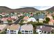 Stunning aerial view of lakeside homes surrounded by scenic desert mountains at 21474 N 56Th Ave, Glendale, AZ 85308
