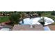 Stunning aerial view showcasing a serene lake, a lush golf course, and beautiful homes with tile roofs at 21474 N 56Th Ave, Glendale, AZ 85308
